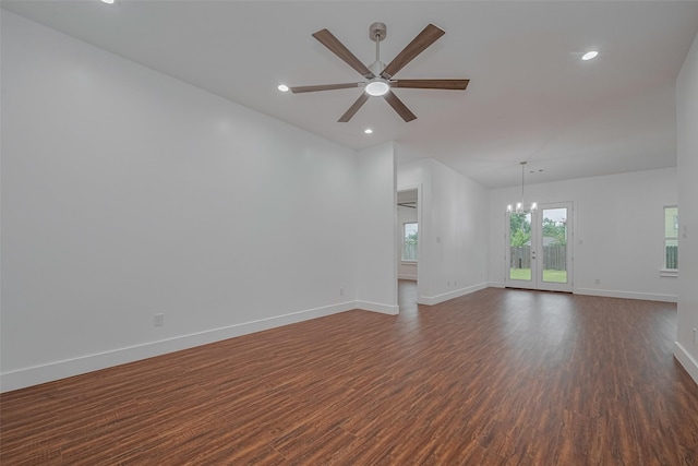 515 Briarcliff Dr, Houston, TX 77076 - empty room with dark wood-type flooring, a ceiling fan, recessed lighting, vaulted ceiling, and a chandelier