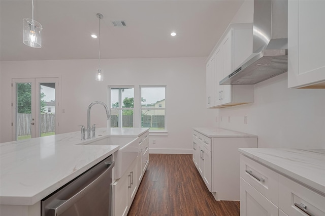 515 Briarcliff Dr, Houston, TX 77076 - kitchen with wall chimney exhaust hood, stainless steel dishwasher, dark wood-style flooring, light stone countertops, and plenty of natural light