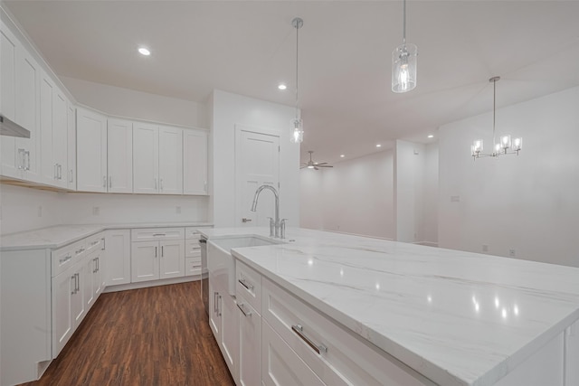 515 Briarcliff Dr, Houston, TX 77076 - kitchen featuring dark wood-type flooring, white cabinetry, recessed lighting, and light stone countertops