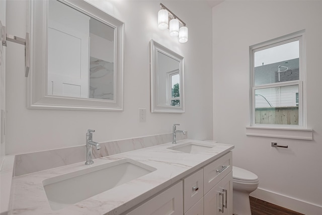 515 Briarcliff Dr, Houston, TX 77076 - bathroom featuring double vanity and wood finished floors