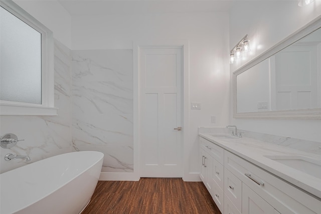 515 Briarcliff Dr, Houston, TX 77076 - full bath featuring a soaking tub, double vanity, and wood finished floors