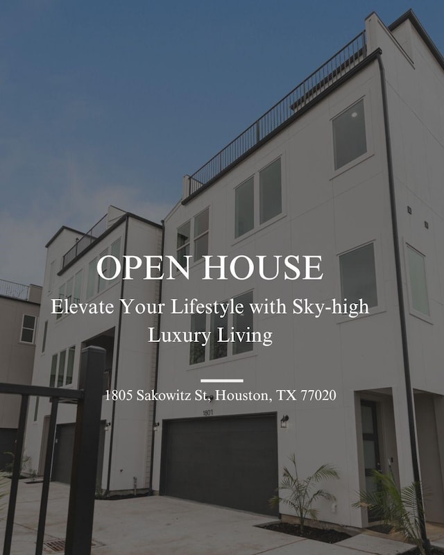 1805 Sakowitz St, Houston, TX 77020 - view of building exterior with a garage and concrete driveway