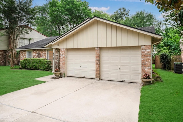 2110 Trailing Vine Rd, Spring, TX 77373 - view of front of home featuring a garage, concrete driveway, a front lawn, and roof with shingles