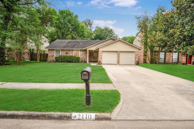 2110 Trailing Vine Rd, Spring, TX 77373 - view of front of property with brick siding, an attached garage, and concrete driveway