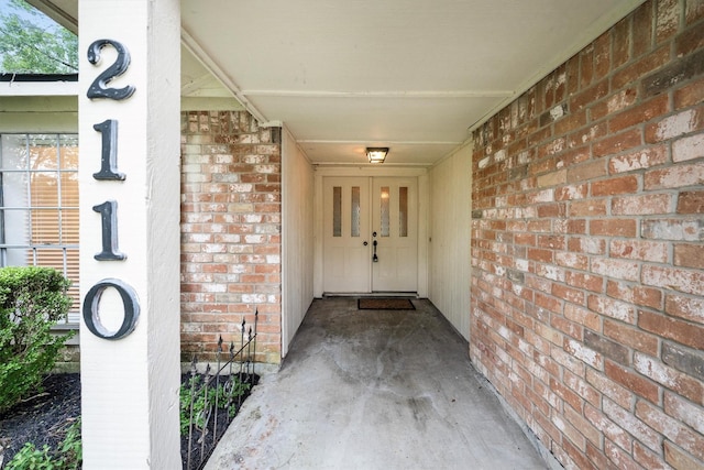2110 Trailing Vine Rd, Spring, TX 77373 - view of exterior entry featuring brick siding