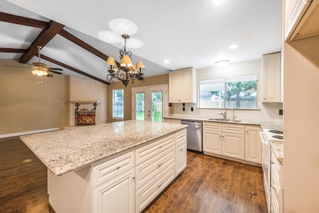 2110 Trailing Vine Rd, Spring, TX 77373 - kitchen featuring dishwasher, dark wood-type flooring, light stone counters, a center island, and a fireplace