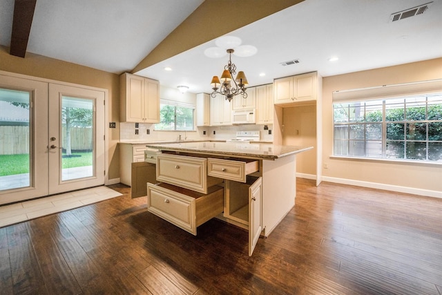 2110 Trailing Vine Rd, Spring, TX 77373 - kitchen featuring range, a chandelier, white microwave, dark wood-type flooring, and pendant lighting