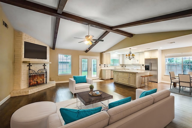 2110 Trailing Vine Rd, Spring, TX 77373 - living area featuring a chandelier, a brick fireplace, plenty of natural light, dark wood-type flooring, and recessed lighting