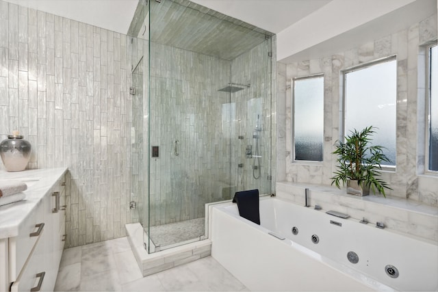 13826 Swan Hollow Ln, Houston, TX 77041 - bathroom featuring a shower stall, a jetted tub, vanity, and tile walls