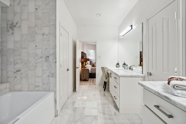 13826 Swan Hollow Ln, Houston, TX 77041 - ensuite bathroom with marble look tile flooring, vanity, and a tub to relax in