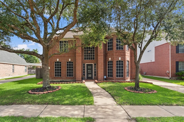 13826 Swan Hollow Ln, Houston, TX 77041 - view of front facade featuring a front yard and brick siding
