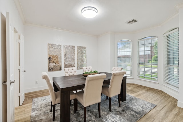 13826 Swan Hollow Ln, Houston, TX 77041 - dining space with crown molding and light wood-style floors