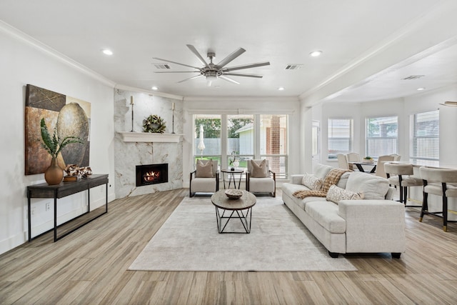 13826 Swan Hollow Ln, Houston, TX 77041 - living room featuring ornamental molding, wood finished floors, a ceiling fan, a premium fireplace, and recessed lighting