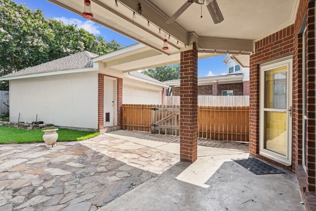 13826 Swan Hollow Ln, Houston, TX 77041 - view of patio featuring a ceiling fan, an outbuilding, and an attached garage