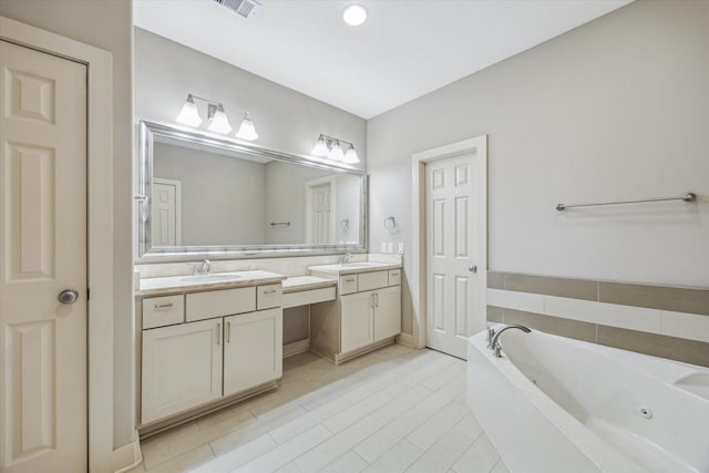 4205 Dickson St, Houston, TX 77007 - bathroom with vanity, a whirlpool tub, and tile patterned flooring
