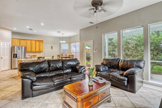 6102 Breezy Hollow Ln, Katy, TX 77450 - living room with ceiling fan, light tile patterned floors, recessed lighting, and a chandelier