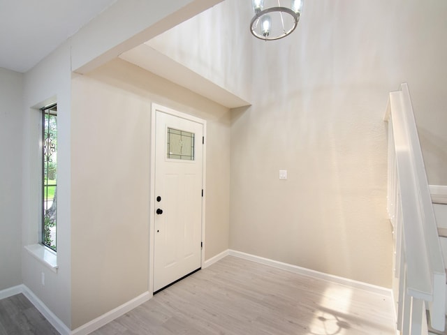11624 Village Place Dr Unit 327, Houston, TX 77077 - foyer featuring wood finished floors and a chandelier