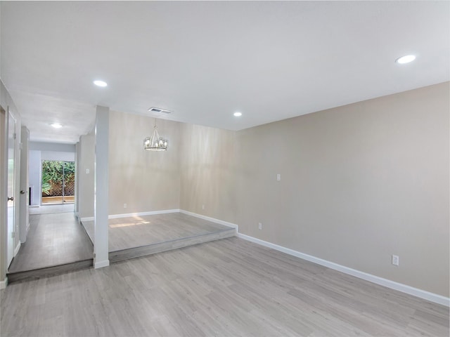 11624 Village Place Dr Unit 327, Houston, TX 77077 - spare room featuring a chandelier, light wood-style floors, and recessed lighting