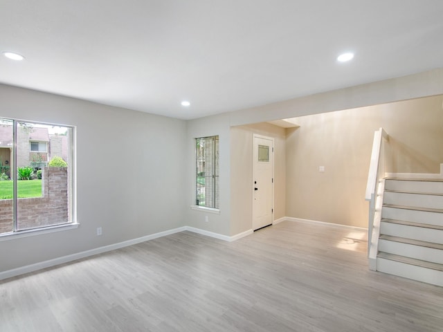 11624 Village Place Dr Unit 327, Houston, TX 77077 - unfurnished living room featuring stairway, wood finished floors, and recessed lighting