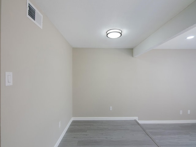 11624 Village Place Dr Unit 327, Houston, TX 77077 - spare room with wood finished floors and beam ceiling