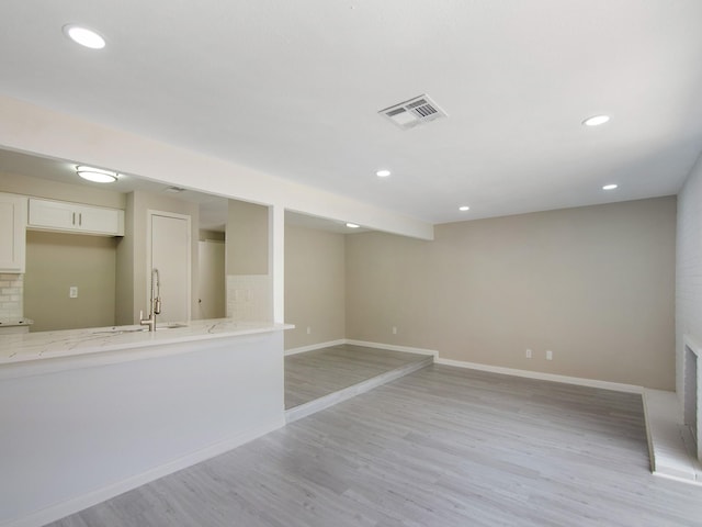 11624 Village Place Dr Unit 327, Houston, TX 77077 - basement with light wood-style flooring and recessed lighting