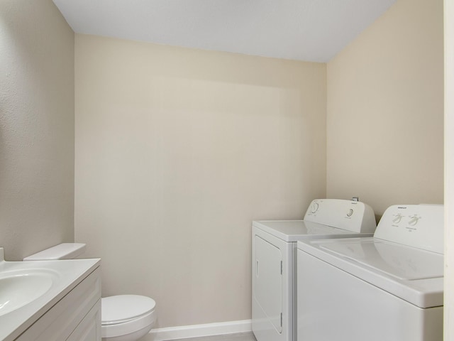 11624 Village Place Dr Unit 327, Houston, TX 77077 - laundry area featuring washing machine and dryer and baseboards
