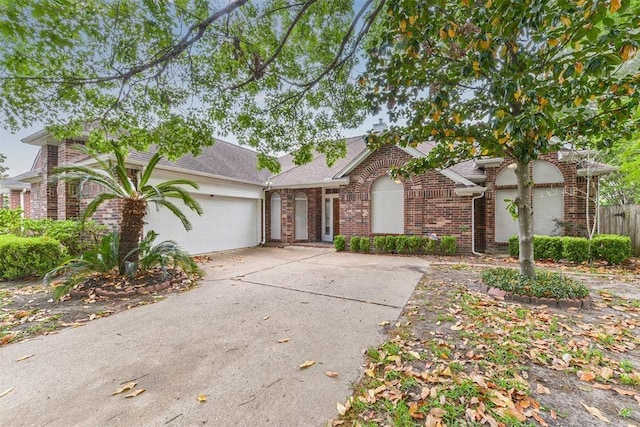 4611 Green Trail Dr, Houston, TX 77084 - view of front of property with brick siding, driveway, a garage, and roof with shingles