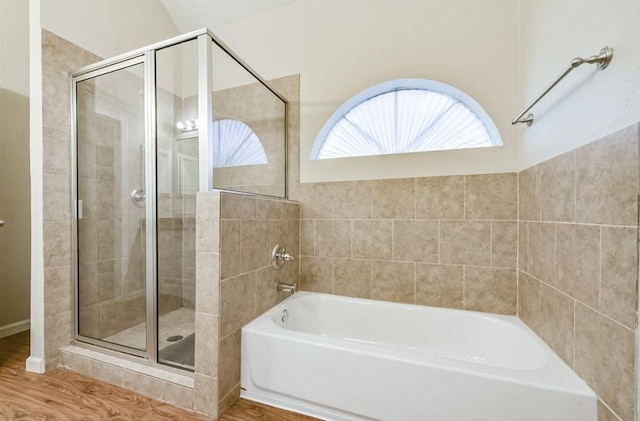 4611 Green Trail Dr, Houston, TX 77084 - full bathroom with a garden tub, a stall shower, and wood finished floors