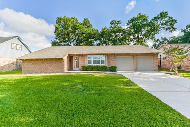10410 Collingswood Rd, La Porte, TX 77571 - single story home with brick siding, a garage, a front yard, and concrete driveway