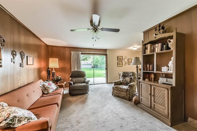 10410 Collingswood Rd, La Porte, TX 77571 - living room with a ceiling fan, carpet flooring, and wooden walls