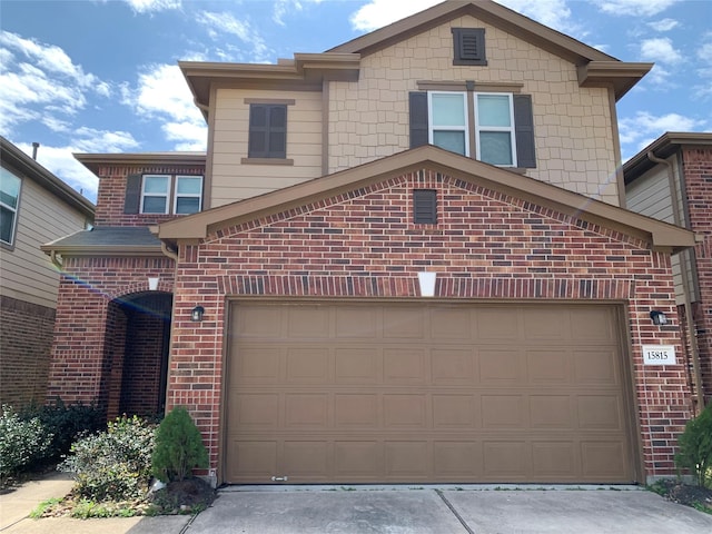 15815 Copper Oak Ln, Houston, TX 77084 - view of front of house with brick siding, a garage, and driveway
