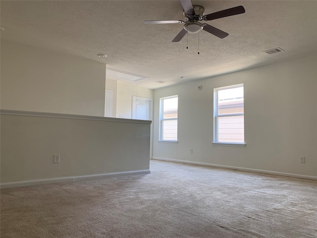 15815 Copper Oak Ln, Houston, TX 77084 - carpeted empty room with attic access, a textured ceiling, and ceiling fan