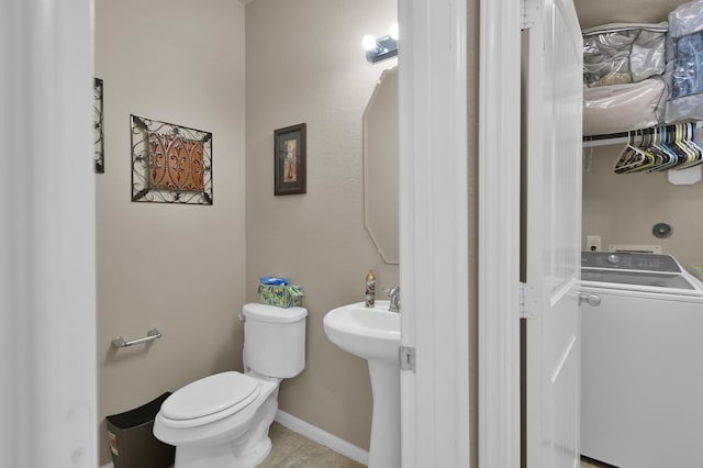7455 Durango Creek Dr, Magnolia, TX 77354 - bathroom featuring washer / clothes dryer and toilet