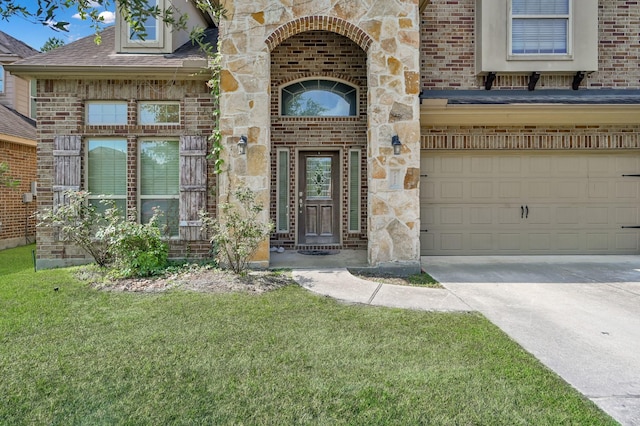 7455 Durango Creek Dr, Magnolia, TX 77354 - view of exterior entry with a garage, brick siding, driveway, a lawn, and a shingled roof