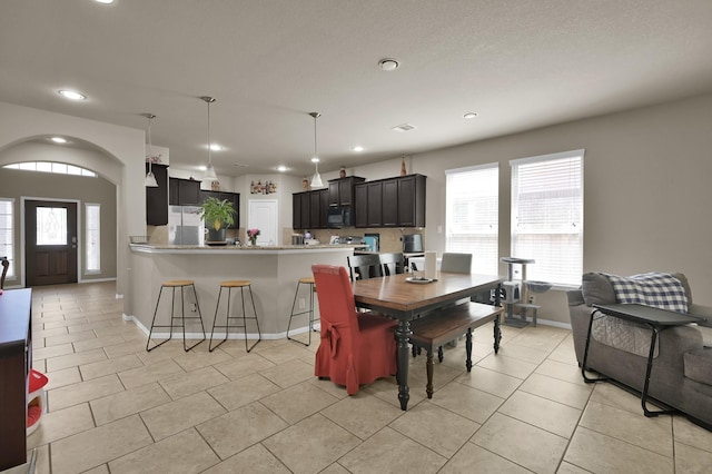 7455 Durango Creek Dr, Magnolia, TX 77354 - dining room with recessed lighting, healthy amount of natural light, and light tile patterned floors