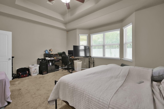 7455 Durango Creek Dr, Magnolia, TX 77354 - carpeted bedroom with a desk, a raised ceiling, and a ceiling fan