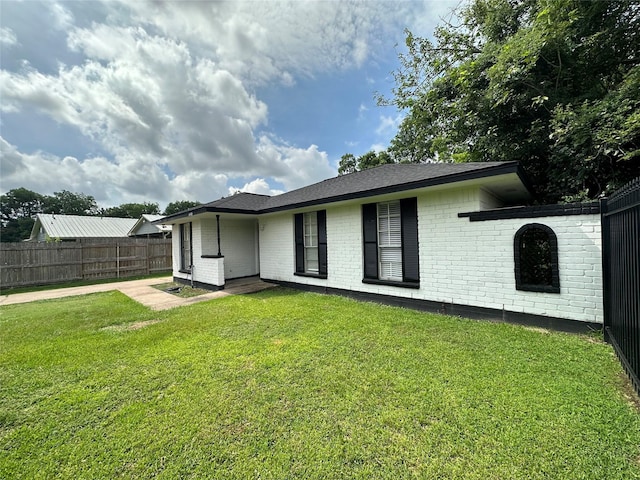 6618 Hopper Rd, Houston, TX 77016 - back of house featuring brick siding and a patio