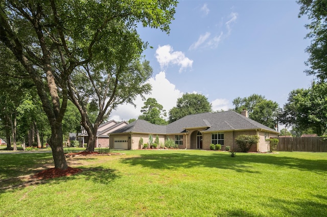 2452 Ripplewood Dr, Conroe, TX 77384 - single story home featuring an attached garage and a chimney