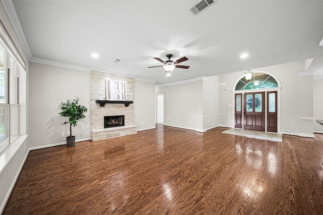 2452 Ripplewood Dr, Conroe, TX 77384 - unfurnished living room with wood finished floors, ceiling fan, a fireplace, recessed lighting, and crown molding