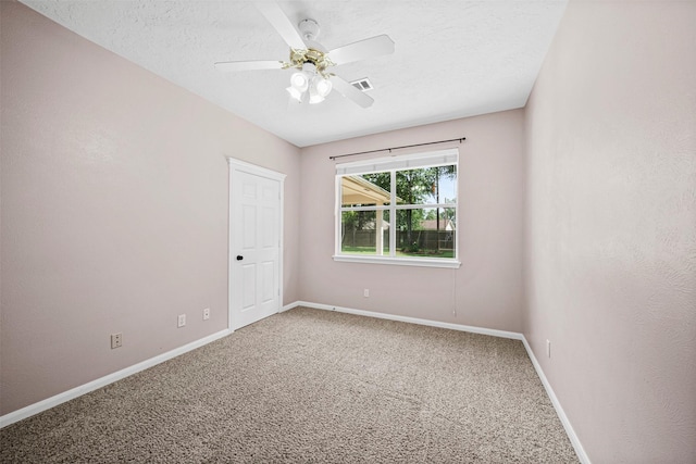 2452 Ripplewood Dr, Conroe, TX 77384 - unfurnished room featuring carpet floors, ceiling fan, and a textured ceiling