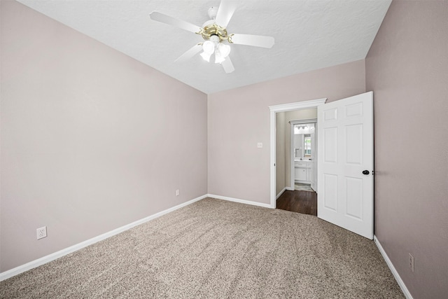 2452 Ripplewood Dr, Conroe, TX 77384 - carpeted spare room with ceiling fan and a textured ceiling
