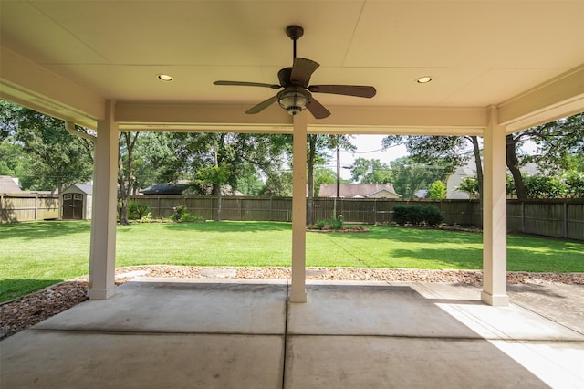 2452 Ripplewood Dr, Conroe, TX 77384 - fenced backyard with a patio, a shed, and ceiling fan