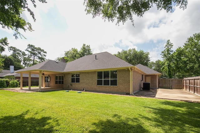 2452 Ripplewood Dr, Conroe, TX 77384 - rear view of house featuring a patio area, brick siding, and a shingled roof