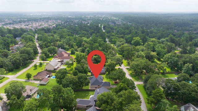 2452 Ripplewood Dr, Conroe, TX 77384 - aerial overview of property's location with nearby suburban area