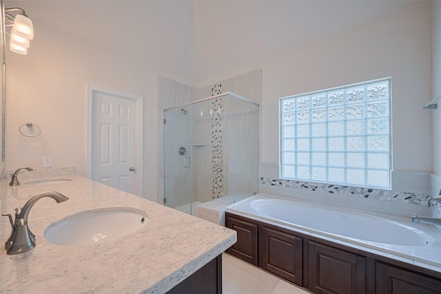 10004 Spring Shadows Park Cir, Houston, TX 77080 - bathroom with a shower stall, a garden tub, and double vanity