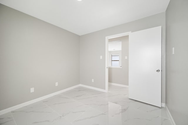 18935 Remington Bend Dr, Houston, TX 77073 - unfurnished room with light marble finish floors and baseboards