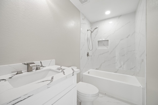 18935 Remington Bend Dr, Houston, TX 77073 - full bath with vanity,  shower combination, marble look tiles, and recessed lighting