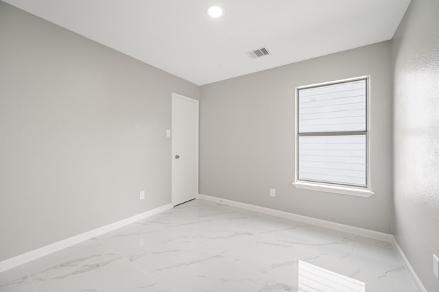 18935 Remington Bend Dr, Houston, TX 77073 - unfurnished room featuring light marble finish floors and recessed lighting