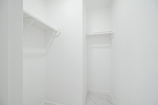 18935 Remington Bend Dr, Houston, TX 77073 - spacious closet featuring marble finish floors
