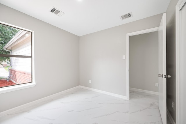 18935 Remington Bend Dr, Houston, TX 77073 - empty room featuring light marble finish floors and baseboards